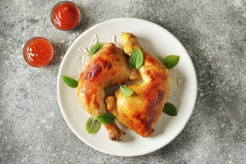 Roasted chicken legs with fresh mint.