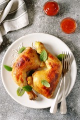 Roasted chicken legs with fresh mint.