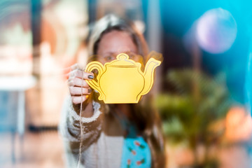 girl holding tea pot