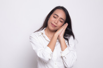 Beautiful young Asian woman with sleeping gesture.