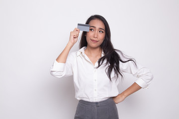 Young Asian woman think with a blank card.