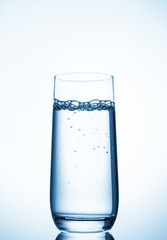 water glass on blue background
