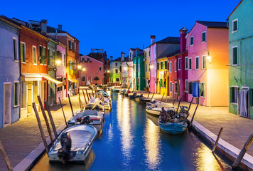 Burano island at night, Venice, Venetian Lagoon, Italy. Colourfully painted houses facades along...