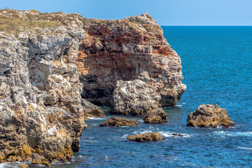 Seascape. Attractive forms of colored rock massifs in Tyulenovo, Northern Black Sea Coast, Bulgaria.