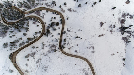 windy Road going through the mountains during winter