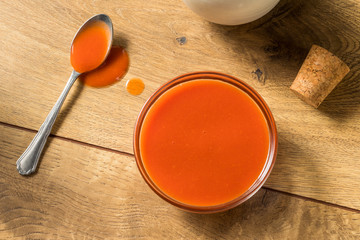 Spicy Hot Organic Red Buffalo Sauce - Powered by Adobe