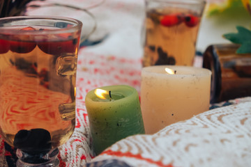 Green candle and delicate red tea