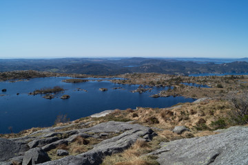 Outdoors, besides a mountain lake and tree