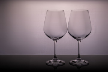 two empty glasses on a white background