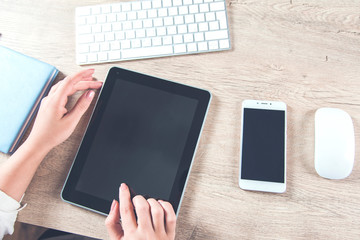 woman hand tablet in working desk
