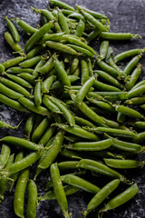 green peas, on asbestos black and white background, in a rustic style