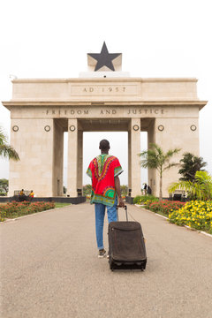Man visiting the independence arch in Accra
