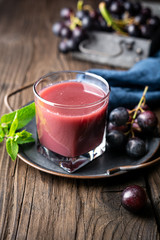 Seasonal homemade drink, freshly made grape juice in glass jar