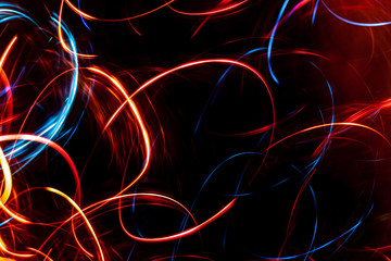 Abstract colored glowing bokeh lines.