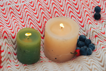 three candles on black background