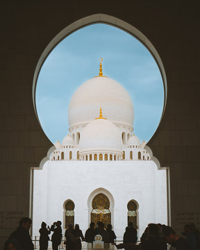 People near white temple