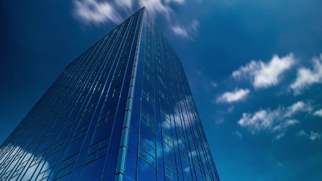clouds over the glass tower. Timelaps.