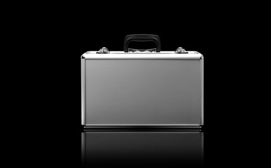 Metallic suitcase isolated on black background
