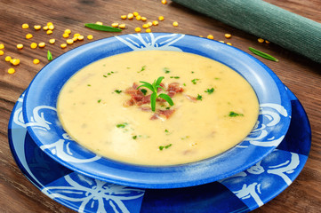 Yellow split pea cream soup with bacon and basil.
