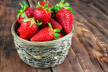 Strawberries on wooden table.