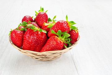 Strawberries on wooden table.