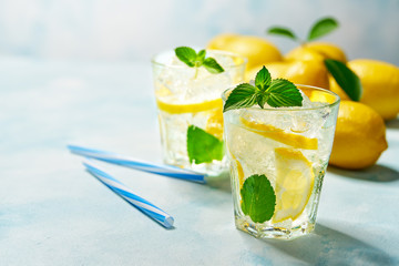 Homemade lemonade  on a light background, cold refreshing drink .