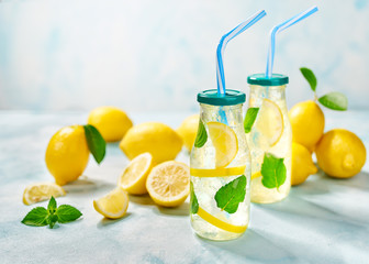 Homemade lemonade  on a light background, cold refreshing drink .