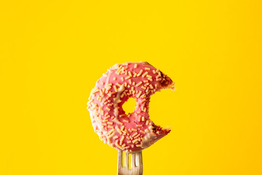 Pink icing-covered doughnut