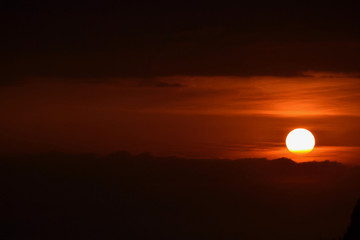 dawn sunrise spreading hues of orange in the sky at tiger hill