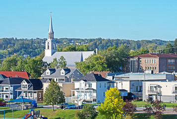 Fototapeta premium A view of Saguenay with the church of Saint Alphonse of Liguori dominating the skyline.