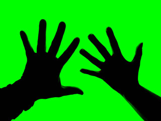 Obraz premium silhouette of a couple's hands on green background friendship and happiness