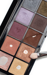 Used palette of eye shadows with a brush