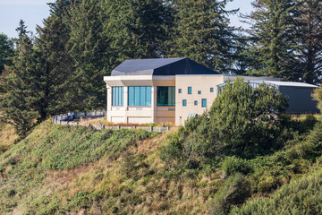 Fototapeta na wymiar USA, Washington State, Ilwaco, Cape Disappointment State Park. The Lewis & Clark Interpretive Center overlooking the Columbia River and Pacific Ocean.