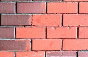 Obraz premium Background-a wall of red and brown bricks