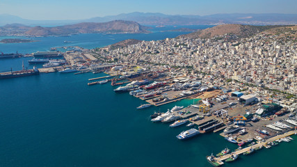 Fototapeta premium Aerial drone photo of industrial cargo container terminal in commercial port of Piraeus, Attica, Greece