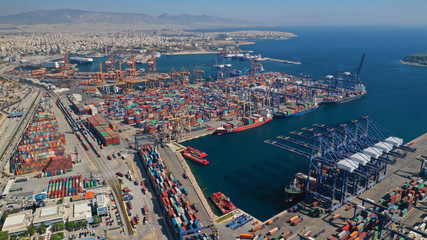 Aerial drone photo of industrial cargo container terminal in commercial port of Piraeus, Attica, Greece