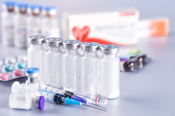 Drug prescription for treatment medication. Pharmaceutical medicament, cure in container for health. Pharmacy theme, capsule pills with medicine antibiotic in packages.