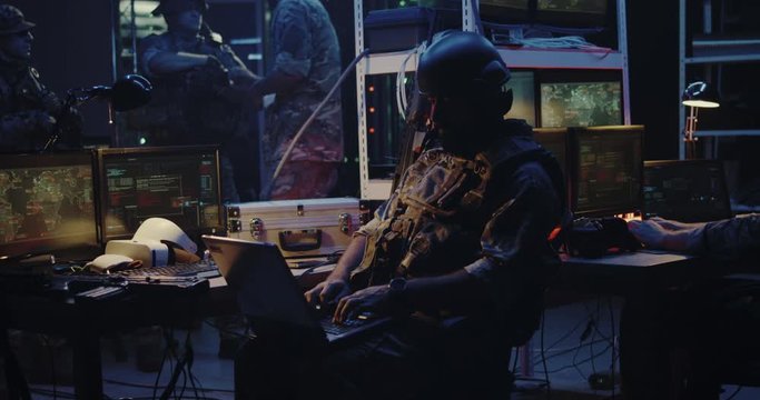 Soldier working on a laptop