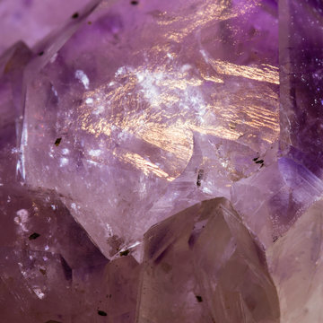 Close-up of amethyst crystal with gold sheen