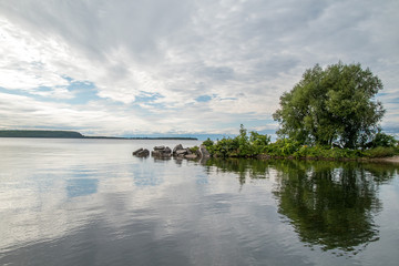Fototapeta premium Tranquil island on a peaceful, calm lake