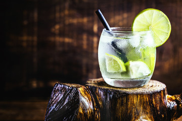 Caipirinha cocktail, close up. Traditional brazilian cocktail made with cachaça, sugar and lemon.