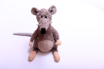 Christmas background. Xmas rat, mouse toy, symbol chinese happy new year 2020. Close up mouse toy in santa claus red hat and new year decorations. horoscope sign 2020. Copy space