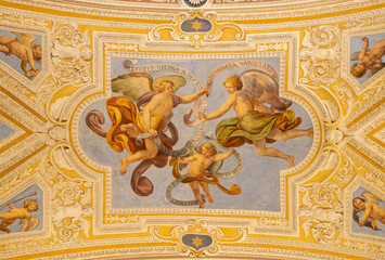Fototapeta na wymiar OSSUCCIO, ITALY - MAY 8, 2015: The baroque fresco of angels with the mariological inscriptions in church Sacro Monte della Beata Vergine del Soccorso by Salvatore Pozzi di Puria (1595 – 1681).
