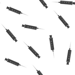 Vector image of  medical syringe for injections and needles  seamless pattern on a white background.