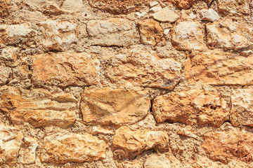 Old weathered brick medieval wall, horizontal grunge background, in Hvar old town quarter, in Croatia
