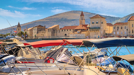 Fototapeta na wymiar Coastal summer landscape - view of the marina for boats and of the Old Town of Trogir, the Adriatic coast of Croatia