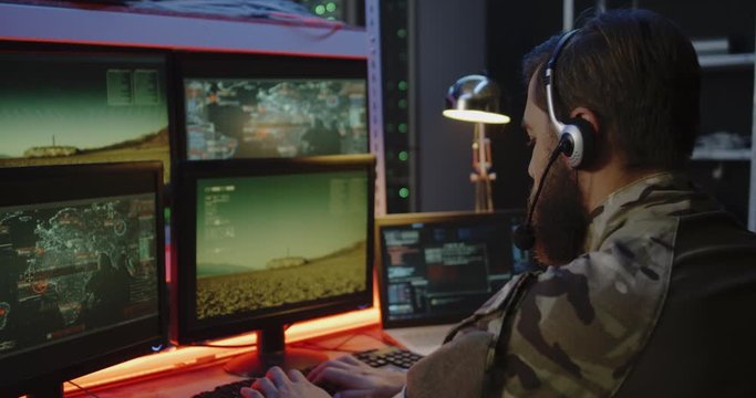 Soldier overseeing rocket launch on computer