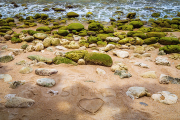 Large green stones on the sea, sand and lettering summer. Thailand. Samui. Gulf of Thailand. Lamai beach