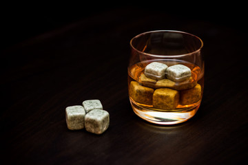 A glass of whiskey with chilled stones. Gentleman's Drink