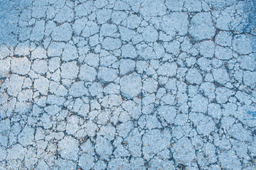 Concrete cracked floor in blue tones